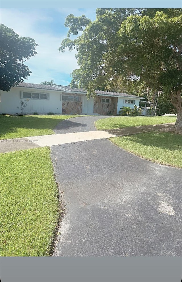 9260 SW 176th St, Palmetto Bay, FL 33157 - single story home featuring a front lawn and asphalt driveway