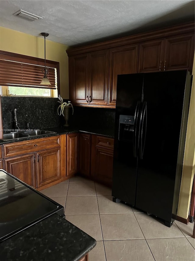 9260 SW 176th St, Palmetto Bay, FL 33157 - kitchen featuring black appliances, decorative backsplash, light tile patterned floors, decorative light fixtures, and a textured ceiling