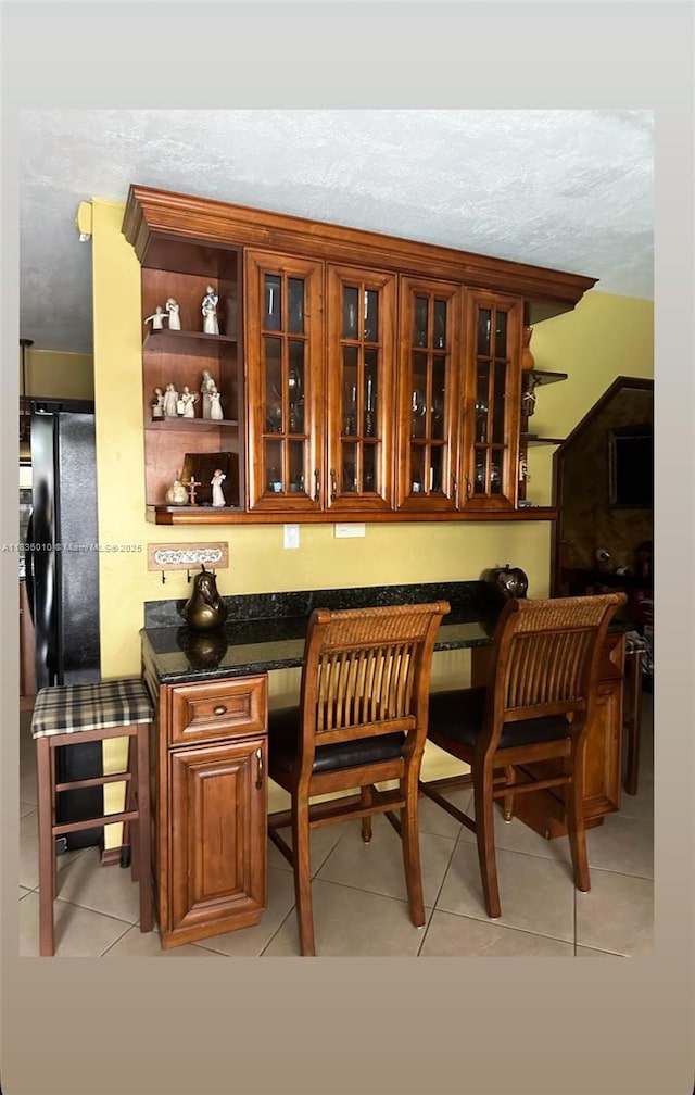 9260 SW 176th St, Palmetto Bay, FL 33157 - bar with light tile patterned flooring and a textured ceiling