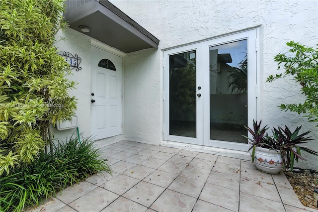 11245 SW 65th St, Miami, FL 33173 - property entrance featuring stucco siding, french doors, and a patio
