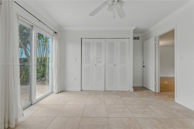 11245 SW 65th St, Miami, FL 33173 - unfurnished bedroom featuring access to exterior, ornamental molding, light tile patterned floors, a closet, and ceiling fan