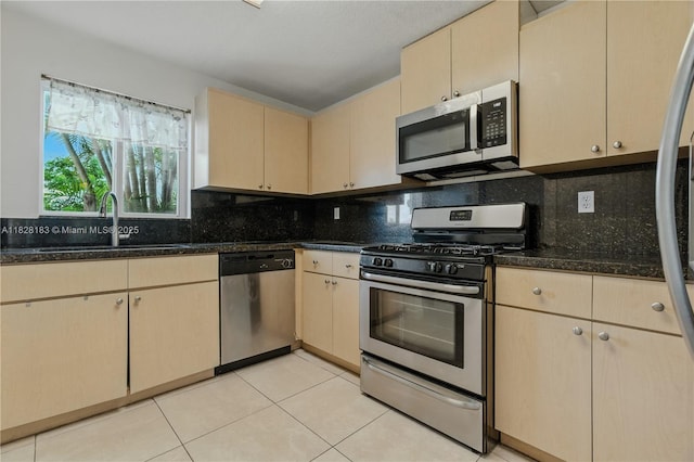 11245 SW 65th St, Miami, FL 33173 - kitchen with appliances with stainless steel finishes, tasteful backsplash, cream cabinets, and light tile patterned flooring