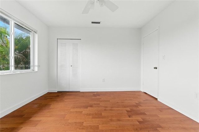 11245 SW 65th St, Miami, FL 33173 - unfurnished bedroom with light wood-style flooring and a ceiling fan