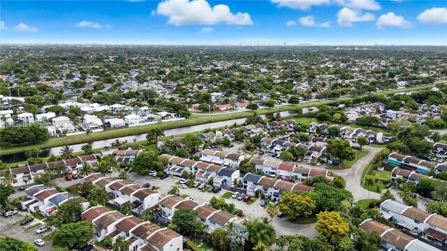 11245 SW 65th St, Miami, FL 33173 - aerial view of property and surrounding area with nearby suburban area and a large body of water