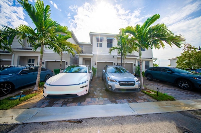 138 SW 171st Way, Pembroke Pines, FL 33027 - multi unit property with driveway, an attached garage, and stucco siding