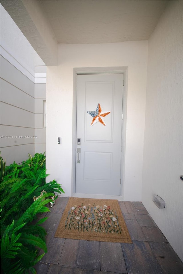 138 SW 171st Way, Pembroke Pines, FL 33027 - doorway to property featuring stucco siding