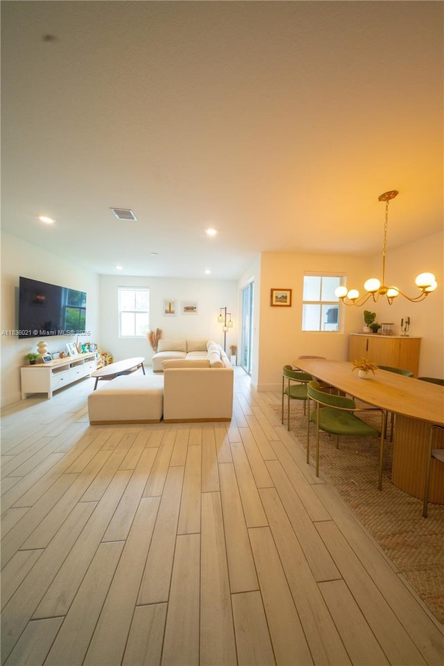 138 SW 171st Way, Pembroke Pines, FL 33027 - living area with a chandelier, light wood-style floors, healthy amount of natural light, and recessed lighting