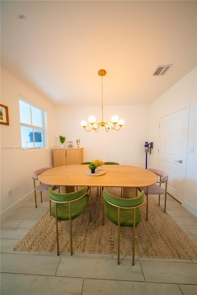 138 SW 171st Way, Pembroke Pines, FL 33027 - dining room featuring a chandelier and baseboards