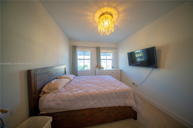 138 SW 171st Way, Pembroke Pines, FL 33027 - carpeted bedroom with baseboards and a chandelier