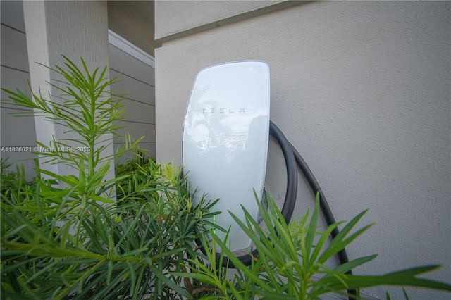 138 SW 171st Way, Pembroke Pines, FL 33027 - exterior view of stucco siding and electric vehicle charger
