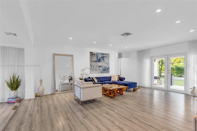 11433 NE 6th Ave, Biscayne Park, FL 33161 - living room featuring light wood-style flooring and recessed lighting