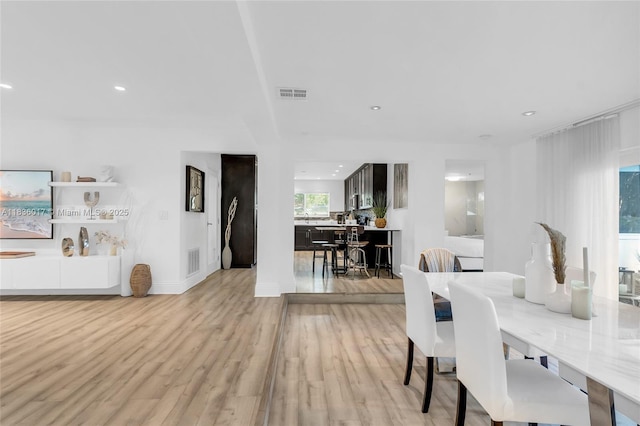 11433 NE 6th Ave, Biscayne Park, FL 33161 - dining space with light wood finished floors and recessed lighting