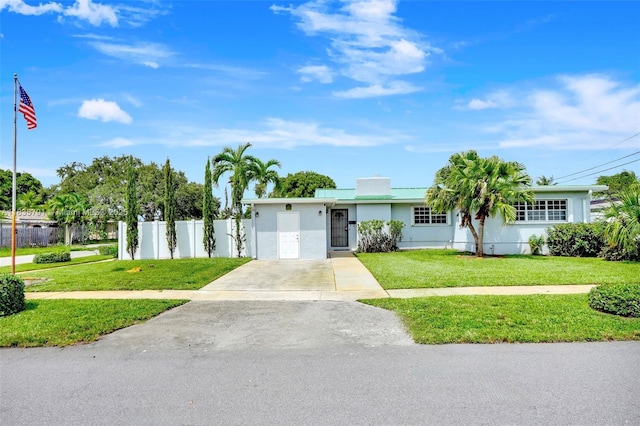 3511 Fairfax Dr, Fort Lauderdale, FL 33312 - ranch-style home featuring concrete driveway and stucco siding
