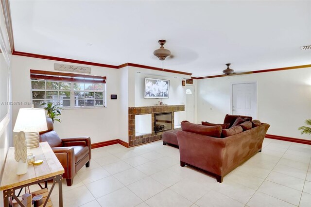 3511 Fairfax Dr, Fort Lauderdale, FL 33312 - living area featuring a glass covered fireplace, ceiling fan, and ornamental molding
