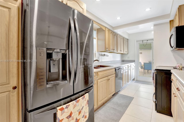3511 Fairfax Dr, Fort Lauderdale, FL 33312 - kitchen with appliances with stainless steel finishes, light countertops, light brown cabinetry, light tile patterned floors, and recessed lighting