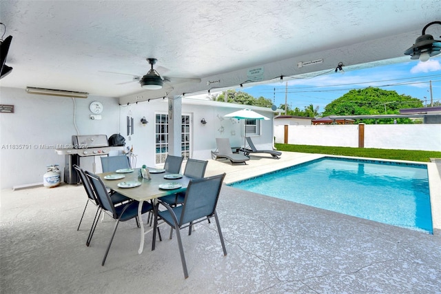 3511 Fairfax Dr, Fort Lauderdale, FL 33312 - view of swimming pool with a ceiling fan, a patio area, and outdoor dining area