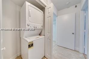 3400 NE 192nd St Unit 1403, Aventura, FL 33180 - laundry area featuring stacked washer and clothes dryer