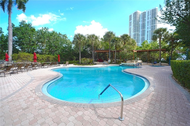 3400 NE 192nd St Unit 1403, Aventura, FL 33180 - community pool featuring a patio area