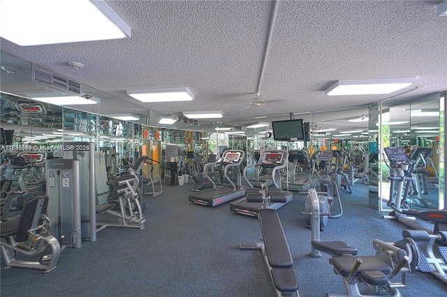 3400 NE 192nd St Unit 1403, Aventura, FL 33180 - exercise room with a textured ceiling