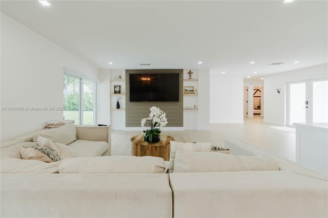 12241 SW 120th Ave, Miami, FL 33186 - living room with light wood finished floors, recessed lighting, and built in shelves
