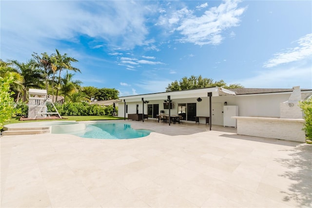 12241 SW 120th Ave, Miami, FL 33186 - view of swimming pool featuring a patio area and a pool with connected hot tub