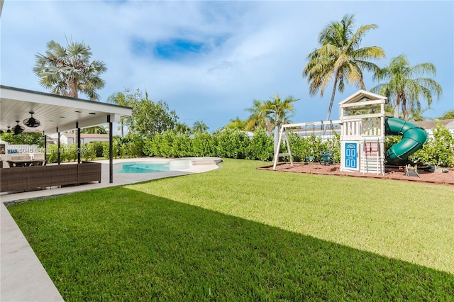 12241 SW 120th Ave, Miami, FL 33186 - view of green lawn with a playground and a ceiling fan