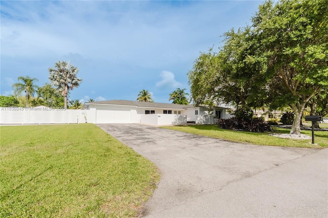 12241 SW 120th Ave, Miami, FL 33186 - view of front of home with driveway, an attached garage, and stucco siding