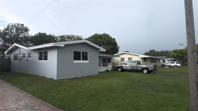 8860 NW 10th St, Pembroke Pines, FL 33024 - view of home's exterior featuring a yard and stucco siding