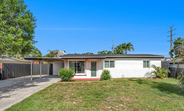 3036 N 58th Ave, Hollywood, FL 33021 - single story home with concrete driveway, a carport, and stucco siding