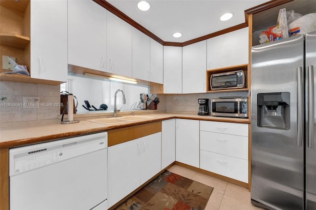 3036 N 58th Ave, Hollywood, FL 33021 - kitchen with appliances with stainless steel finishes, light countertops, open shelves, white cabinets, and recessed lighting