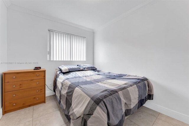 3036 N 58th Ave, Hollywood, FL 33021 - tiled bedroom with crown molding and baseboards
