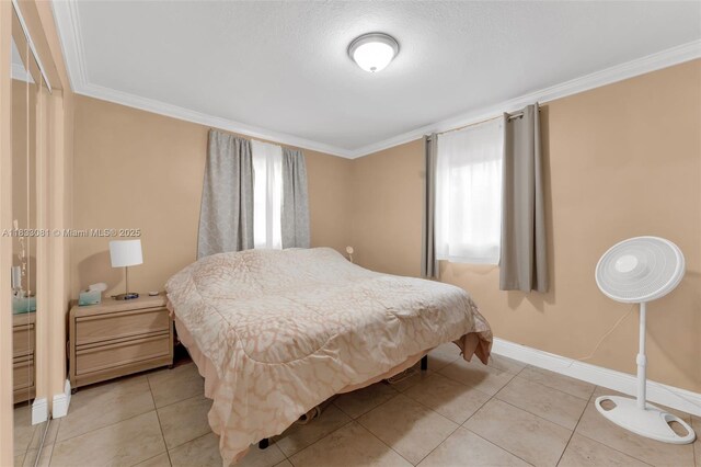 3036 N 58th Ave, Hollywood, FL 33021 - bedroom featuring crown molding and light tile patterned floors