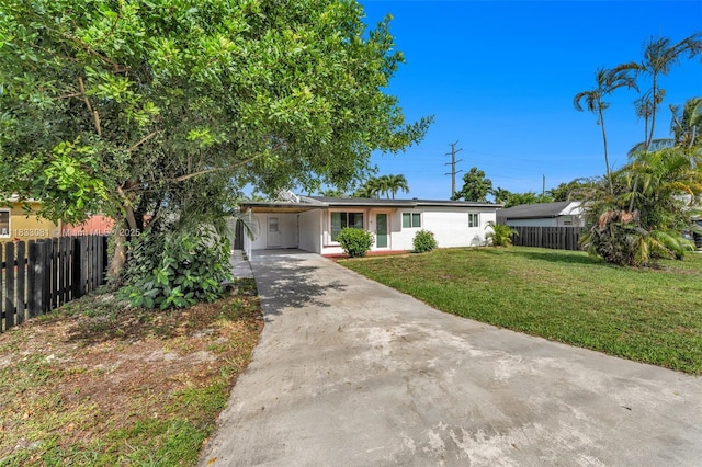 3036 N 58th Ave, Hollywood, FL 33021 - ranch-style house with driveway and a carport