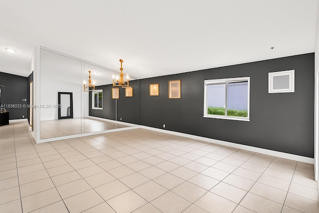 2472 SW 106th Ave, Miramar, FL 33025 - empty room featuring a chandelier and light tile patterned floors