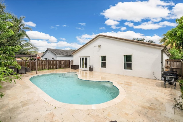 2472 SW 106th Ave, Miramar, FL 33025 - view of swimming pool featuring french doors, a fenced backyard, a patio, and a gazebo