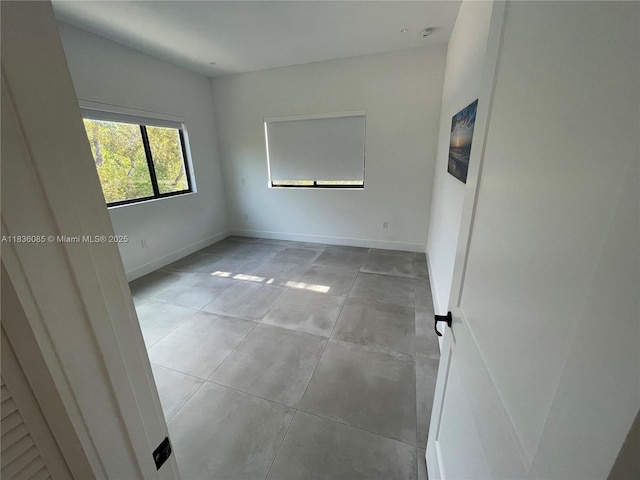 12 Coral Dr, Key Largo, FL 33037 - unfurnished room featuring baseboards and tile patterned flooring