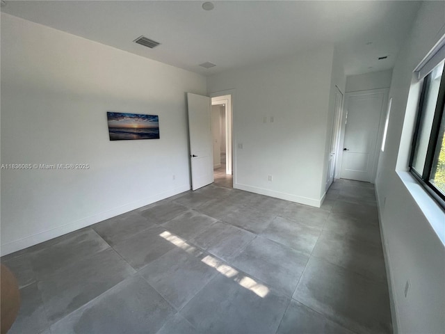 12 Coral Dr, Key Largo, FL 33037 - unfurnished room featuring baseboards and concrete floors