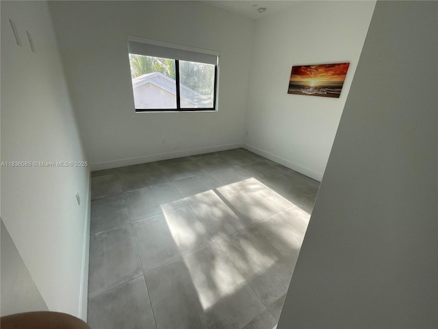 12 Coral Dr, Key Largo, FL 33037 - tiled empty room featuring baseboards