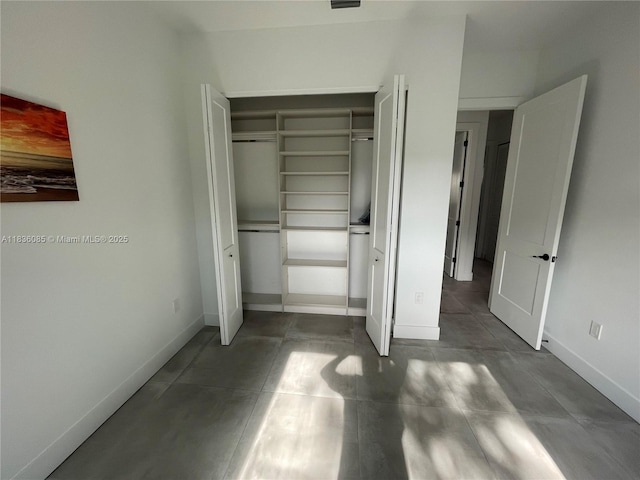 12 Coral Dr, Key Largo, FL 33037 - unfurnished bedroom featuring a closet and baseboards
