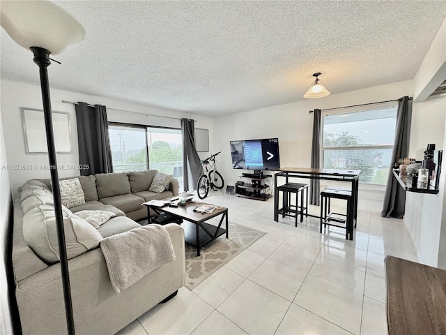 505 S Pine Island Rd Unit 407B, Plantation, FL 33324 - living area featuring light tile patterned floors and a textured ceiling