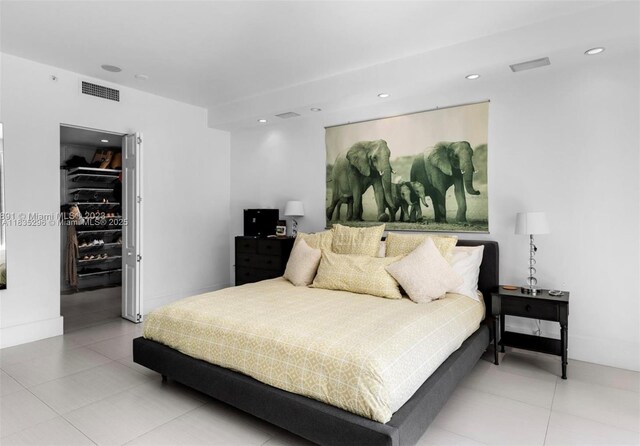 785 Crandon Blvd Unit 302, Key Biscayne, FL 33149 - bedroom featuring a walk in closet, recessed lighting, light tile patterned flooring, and a closet