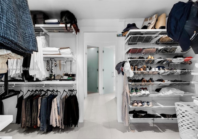 785 Crandon Blvd Unit 302, Key Biscayne, FL 33149 - walk in closet featuring tile patterned floors