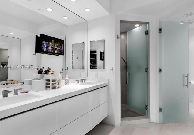 785 Crandon Blvd Unit 302, Key Biscayne, FL 33149 - full bathroom with double vanity, a stall shower, recessed lighting, and tile patterned flooring