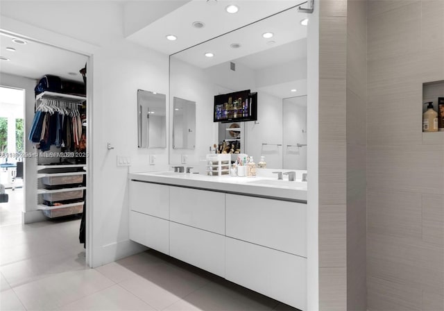 785 Crandon Blvd Unit 302, Key Biscayne, FL 33149 - bathroom with double vanity, recessed lighting, a walk in closet, and tile patterned flooring