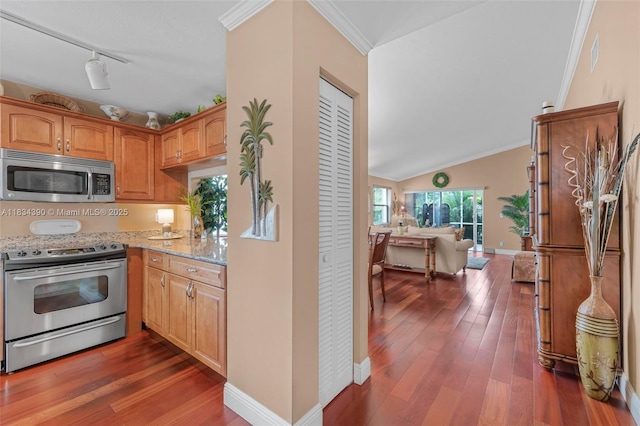 9614 NW 8th Cir, Plantation, FL 33324 - kitchen with stainless steel appliances, light stone countertops, hardwood / wood-style flooring, open floor plan, and track lighting