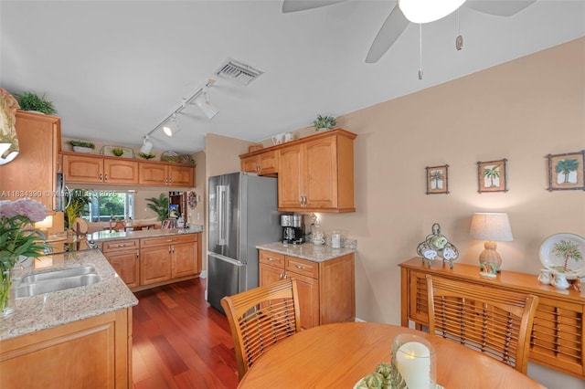 9614 NW 8th Cir, Plantation, FL 33324 - kitchen with freestanding refrigerator, track lighting, a ceiling fan, dark wood-style floors, and light stone countertops