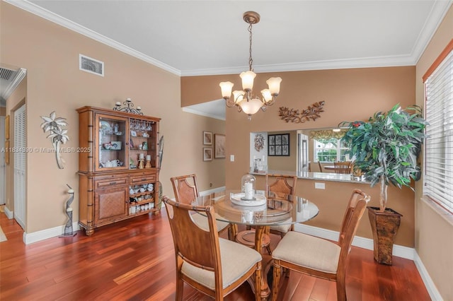 9614 NW 8th Cir, Plantation, FL 33324 - dining room featuring crown molding, a chandelier, and wood finished floors
