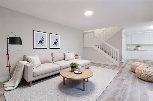 1170 SW 118th Ter, Davie, FL 33325 - living room featuring light wood-style floors and stairway
