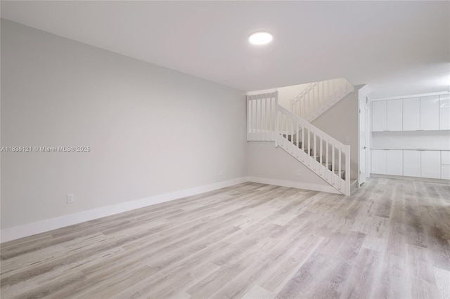 1170 SW 118th Ter, Davie, FL 33325 - empty room with light wood-type flooring and stairs