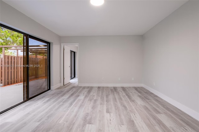 1170 SW 118th Ter, Davie, FL 33325 - spare room with light wood-style flooring and baseboards